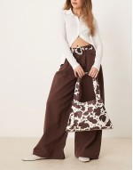 tapered shoulder bag in cow print