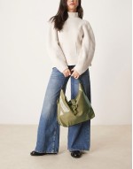 statement buckle slouch tote bag in light Khaki